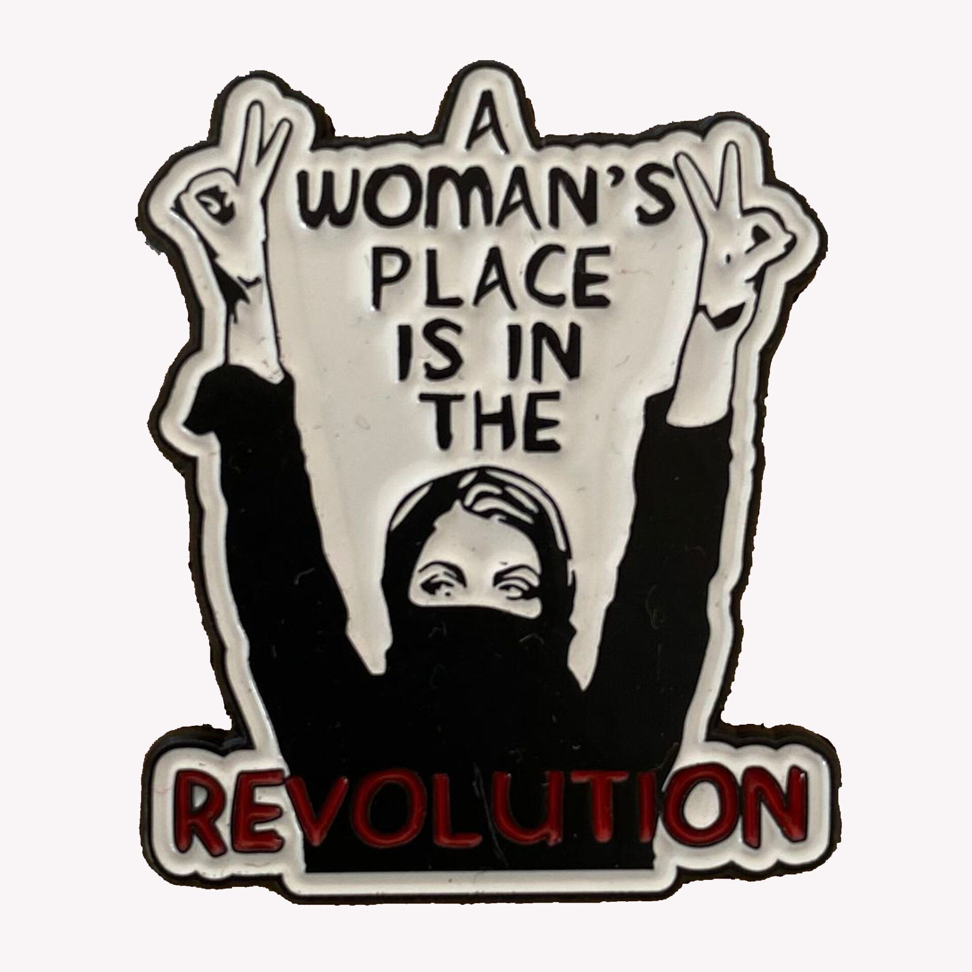 Pin's féministe "A woman's place is in the revolution"