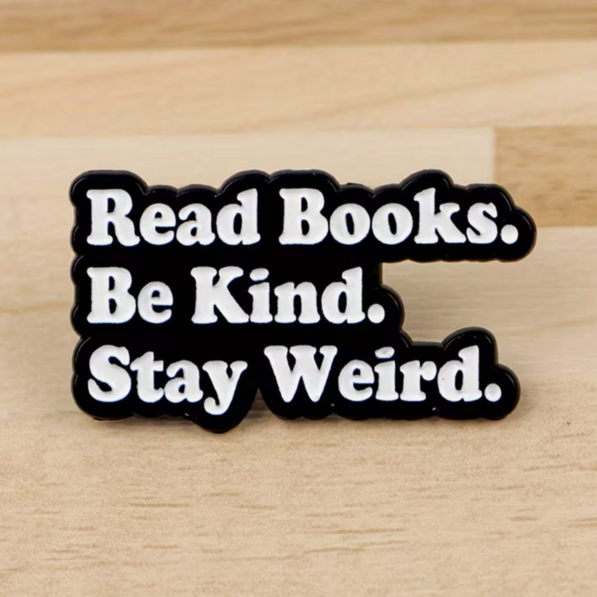 Pin's militant "Read books, Be kind, Stay Weird" Le Misanthrope